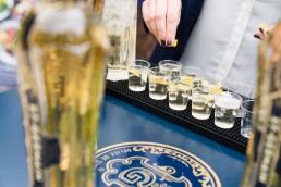 corporate brand giveaways - St Germain alcohol sampling - bar tender pours samples of St Germain Spritz