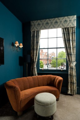interior photographer london - curved sofa in front of a window