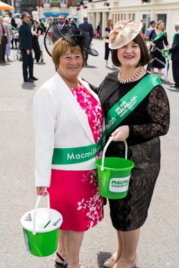 2 volunteers collecting money at York Races for Macmillan