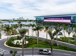 Exterior of the SBC Summit Americas conference and exhibition centre in Fort Lauderdale with palm trees in the foreground